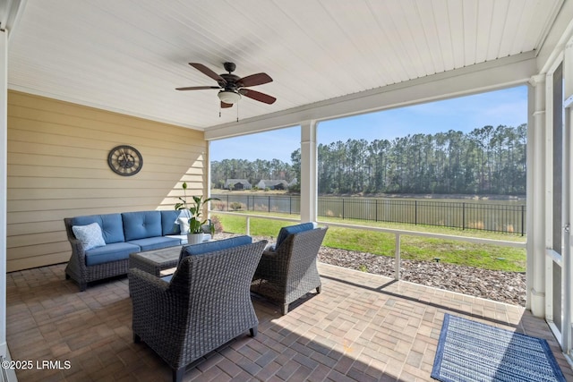 sunroom / solarium featuring wooden ceiling and a ceiling fan