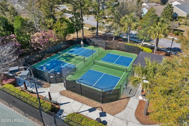 view of tennis court with fence