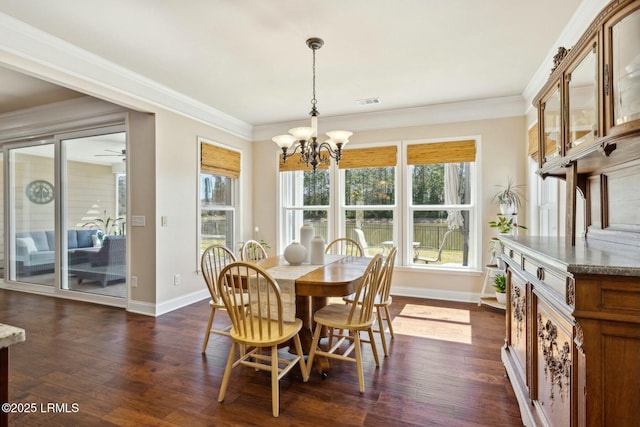 dining space with dark wood finished floors, a healthy amount of sunlight, baseboards, and ornamental molding