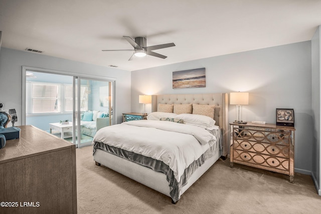 carpeted bedroom featuring access to exterior, ceiling fan, and visible vents