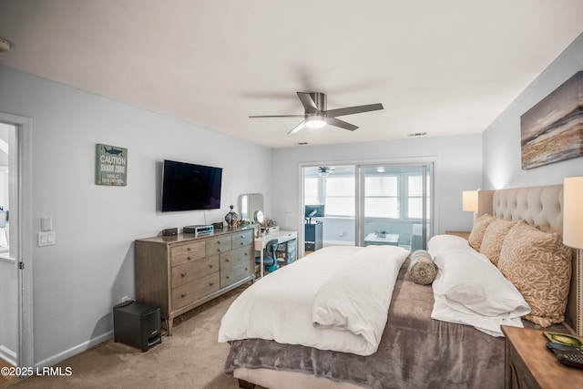 bedroom featuring ceiling fan, visible vents, baseboards, and light colored carpet