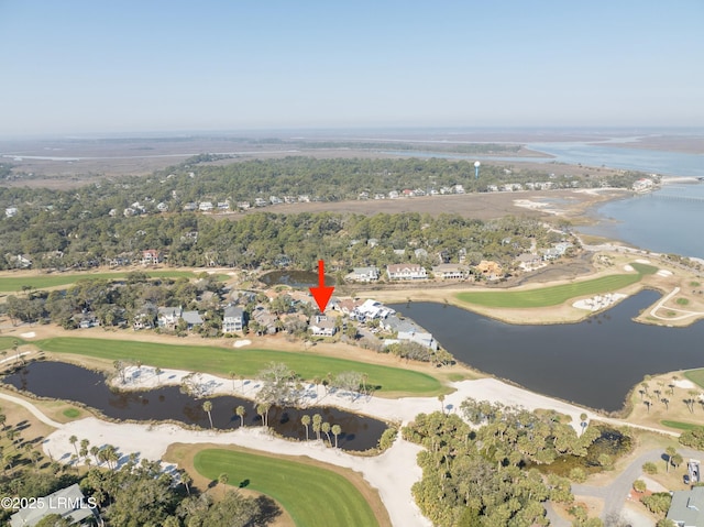 birds eye view of property featuring golf course view and a water view