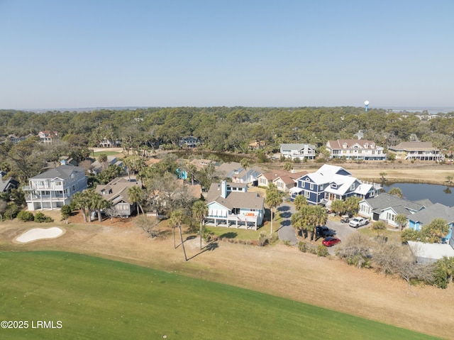 aerial view with a residential view, view of golf course, and a water view