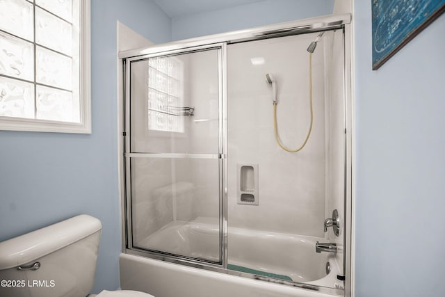 full bath with toilet and combined bath / shower with glass door