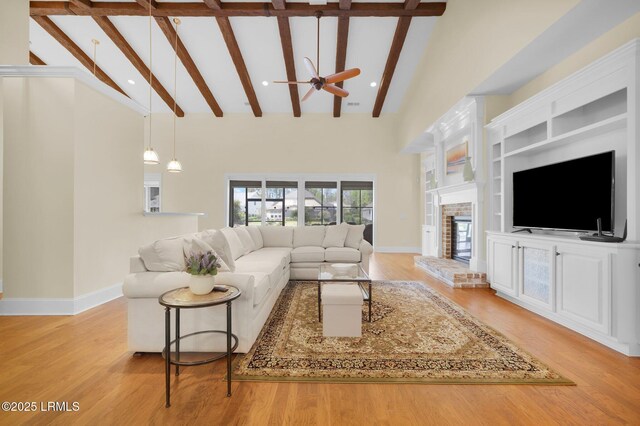222 Hampton Lake Dr, Bluffton, SC 29910 - living room featuring baseboards, a brick fireplace, ceiling fan, and beamed ceiling