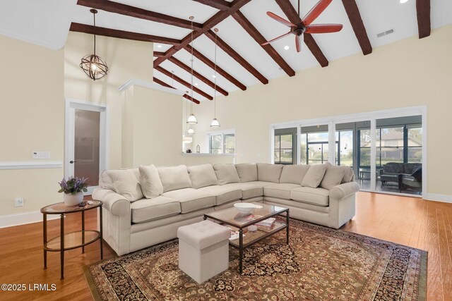 222 Hampton Lake Dr, Bluffton, SC 29910 - living room with visible vents, beam ceiling, high vaulted ceiling, and wood finished floors