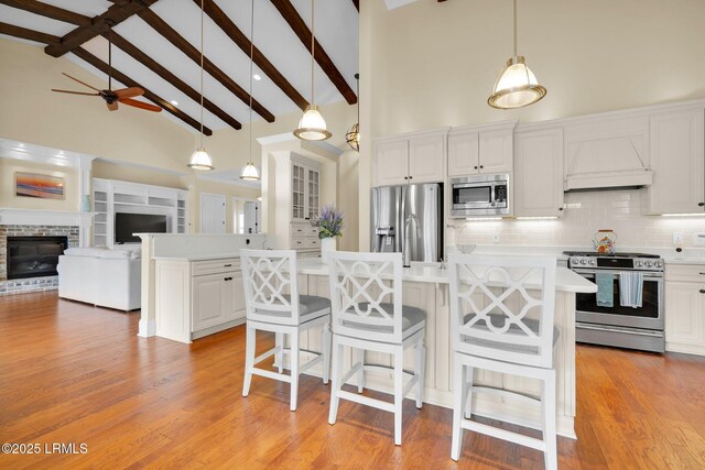 222 Hampton Lake Dr, Bluffton, SC 29910 - kitchen featuring a ceiling fan, backsplash, light countertops, high vaulted ceiling, and stainless steel appliances