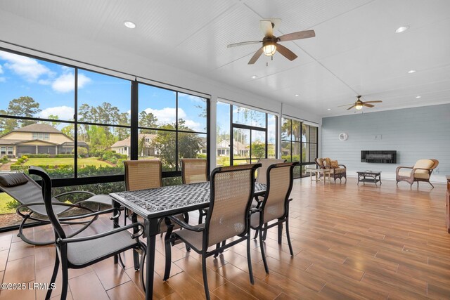222 Hampton Lake Dr, Bluffton, SC 29910 - sunroom featuring outdoor dining area, a ceiling fan, and a glass covered fireplace