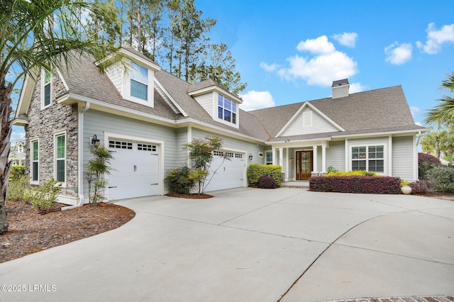 222 Hampton Lake Dr, Bluffton, SC 29910 - view of front of house with roof with shingles, stone siding, a chimney, and concrete driveway