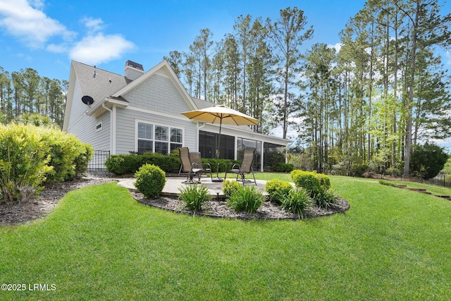 222 Hampton Lake Dr, Bluffton, SC 29910 - back of house with a patio, fence, a yard, and a chimney