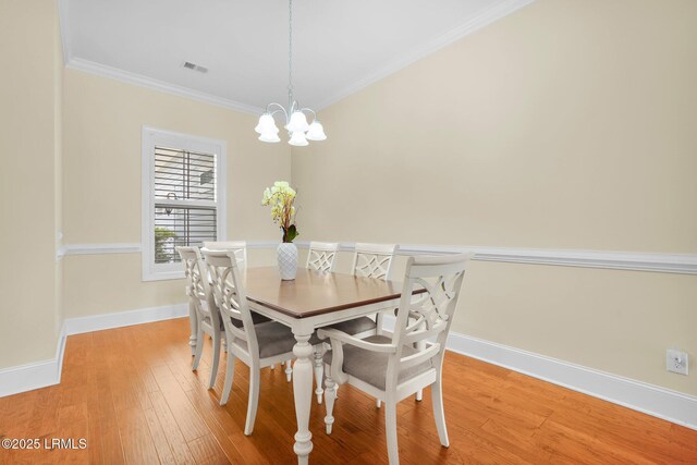 222 Hampton Lake Dr, Bluffton, SC 29910 - dining space with crown molding, a chandelier, baseboards, light wood-type flooring, and visible vents