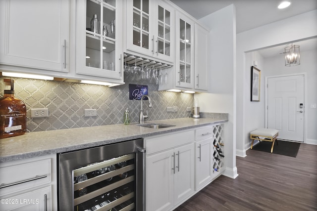 223 Rudder Run, Bluffton, SC 29910 - indoor wet bar featuring beverage cooler, dark wood finished floors, decorative backsplash, and recessed lighting