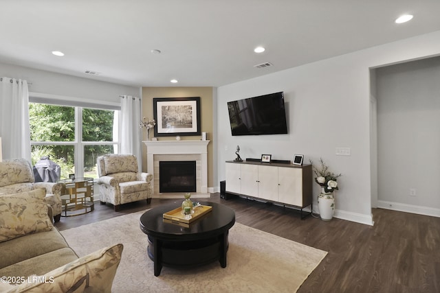 223 Rudder Run, Bluffton, SC 29910 - living area with dark wood-style floors, recessed lighting, and a fireplace with flush hearth