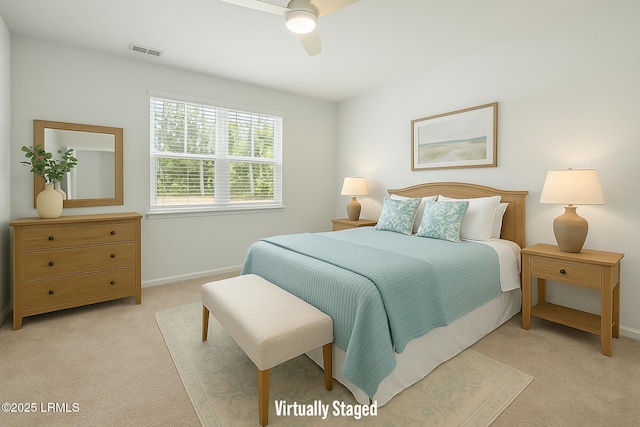 bedroom with light colored carpet, baseboards, visible vents, and ceiling fan