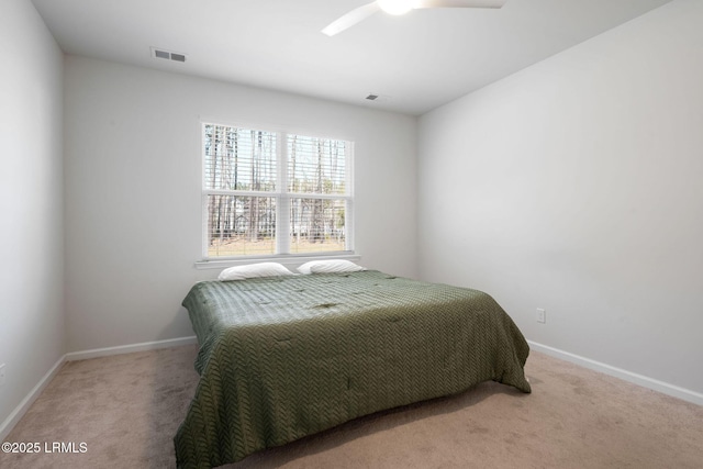 carpeted bedroom featuring visible vents, ceiling fan, and baseboards