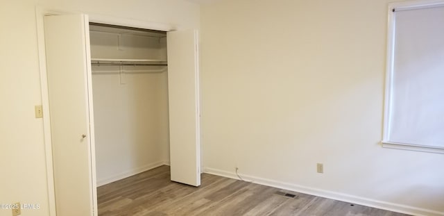 82 Sunset Blvd, Beaufort, SC 29907 - unfurnished bedroom with light wood finished floors and a closet