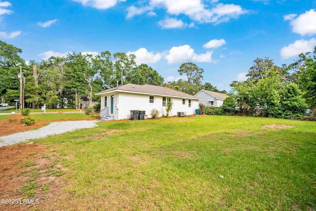 1117 Old Trail Rd, Beaufort, SC 29902 - rear view of property featuring a yard and entry steps