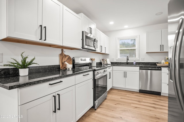 1117 Old Trail Rd, Beaufort, SC 29902 - kitchen featuring stainless steel appliances, a sink, recessed lighting, white cabinetry, and light wood-type flooring