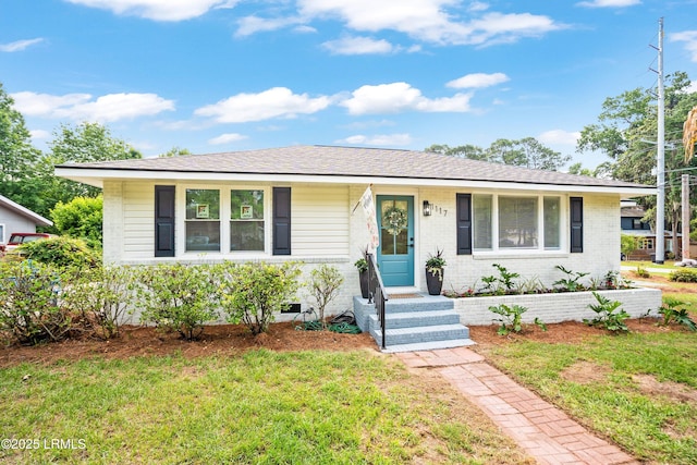 1117 Old Trail Rd, Beaufort, SC 29902 - view of front of home with brick siding and a front lawn
