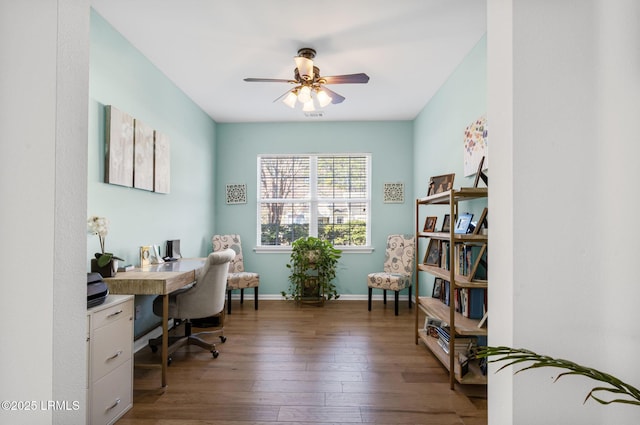 office area with ceiling fan, hardwood / wood-style floors, visible vents, and baseboards