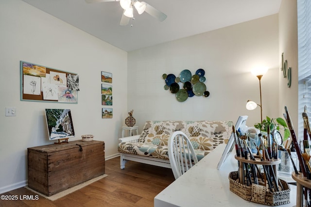 bedroom featuring ceiling fan, baseboards, and wood finished floors