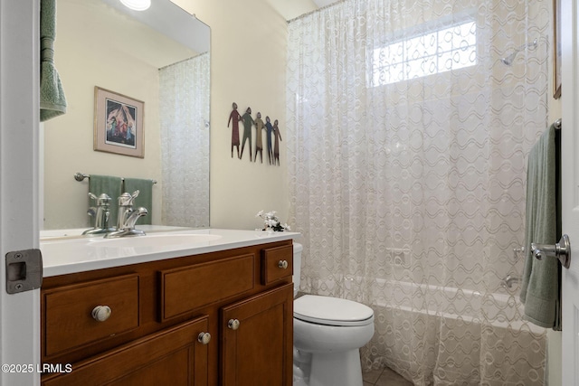 bathroom featuring shower / tub combo, tile patterned flooring, vanity, and toilet