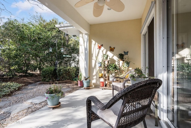 view of patio featuring ceiling fan