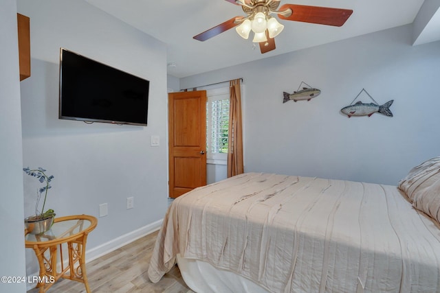 bedroom with light wood-type flooring and ceiling fan