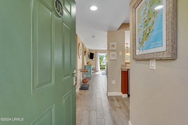 corridor featuring light hardwood / wood-style floors