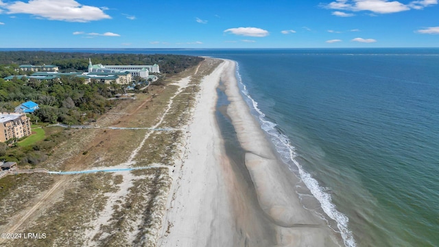 bird's eye view featuring a water view and a view of the beach