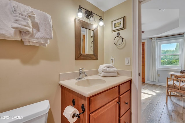 bathroom with vanity and toilet