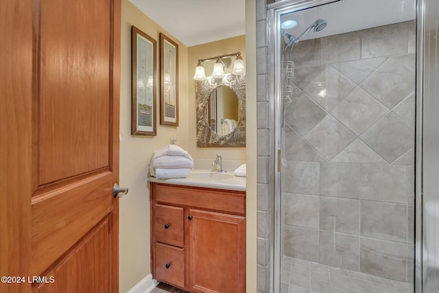 bathroom featuring vanity and an enclosed shower