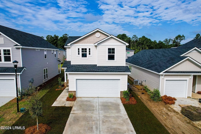 front of property with a garage