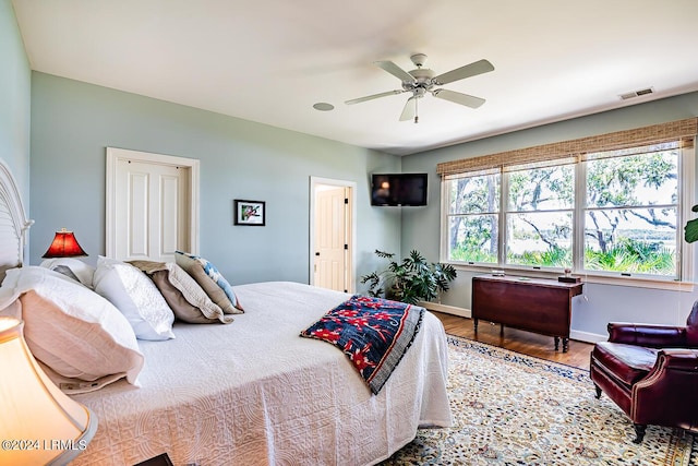 bedroom featuring hardwood / wood-style floors and ceiling fan