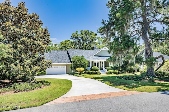 view of front of home with a garage and a front yard