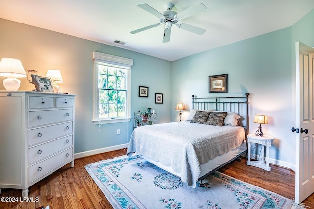 bedroom featuring ceiling fan and hardwood / wood-style floors