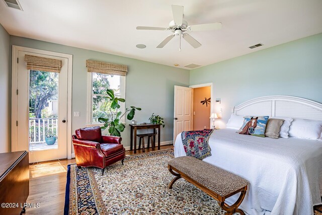 bedroom with access to outside, ceiling fan, and light hardwood / wood-style flooring