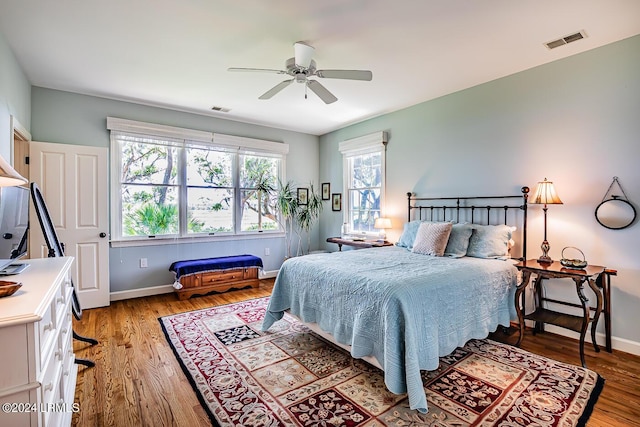 bedroom with ceiling fan and light hardwood / wood-style floors