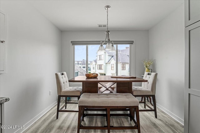 dining room featuring light hardwood / wood-style flooring