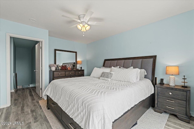 bedroom featuring hardwood / wood-style floors and ceiling fan