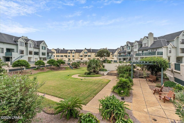 view of property's community with a yard