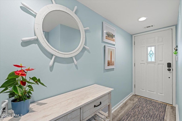 foyer entrance with hardwood / wood-style floors