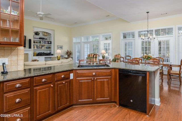 34 Osprey Cir, Okatie, SC 29909 - kitchen with sink, light hardwood / wood-style flooring, dark stone countertops, backsplash, and black dishwasher
