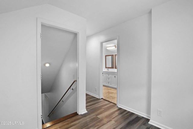 53 Salt Marsh Dr, Hilton Head Island, SC 29926 - corridor featuring an upstairs landing, dark wood finished floors, a sink, baseboards, and recessed lighting