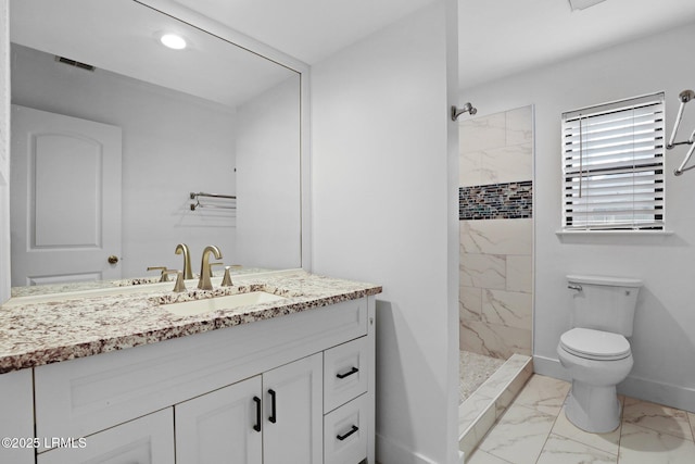 53 Salt Marsh Dr, Hilton Head Island, SC 29926 - full bathroom featuring marble look tile flooring, tiled shower, toilet, vanity, and baseboards