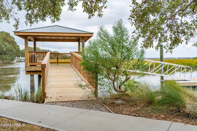 dock area featuring a gazebo and a water view