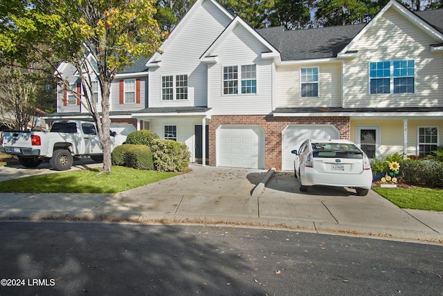 townhome / multi-family property featuring a garage