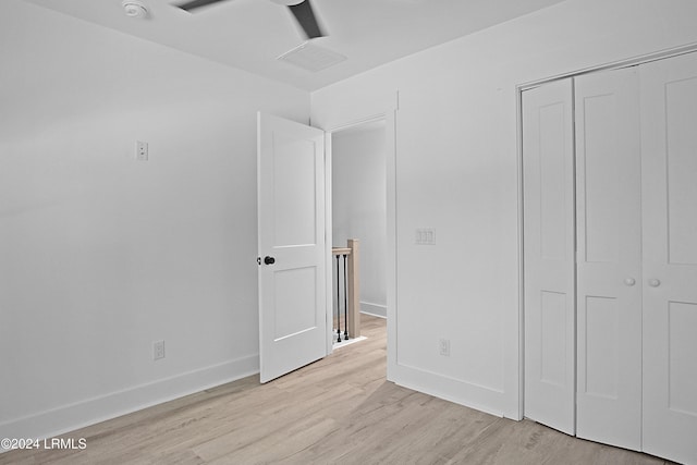 329 S St, Bluffton, SC 29910 - unfurnished bedroom featuring ceiling fan, a closet, and light hardwood / wood-style flooring