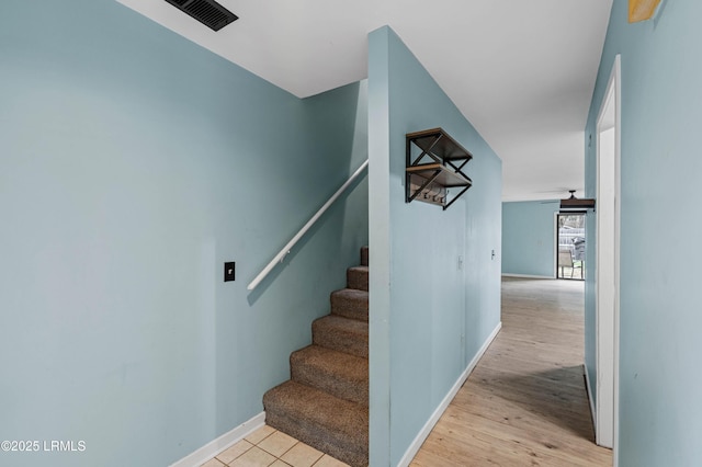 2304 Pine Ct S Unit 1, Beaufort, SC 29902 - staircase with baseboards and wood finished floors