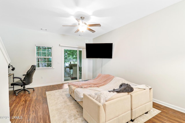 bedroom with ceiling fan, hardwood / wood-style floors, and access to outside